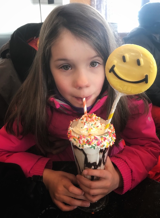 Girl drinking milkshake at the Ice Cream Parlour on Beaver Creek